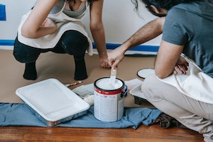 Image of homeowners prepping to paint on Stacie Coder Realtor blog
